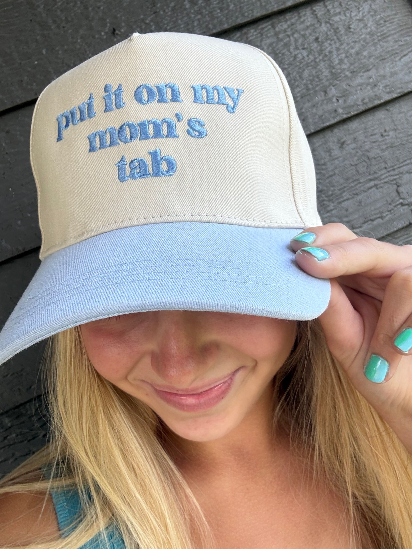 Put It On My Mom's Tab Embroidery Cap - Multiple Colors (Dark Brown, Black, Light Blue)