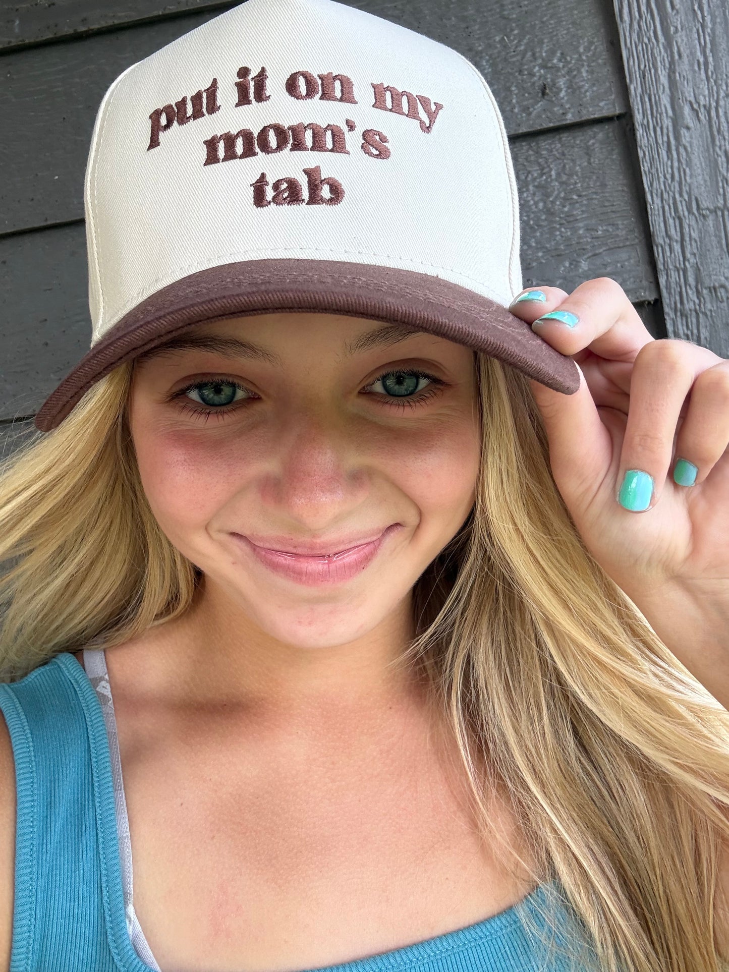 Put It On My Mom's Tab Embroidery Cap - Multiple Colors (Dark Brown, Black, Light Blue)